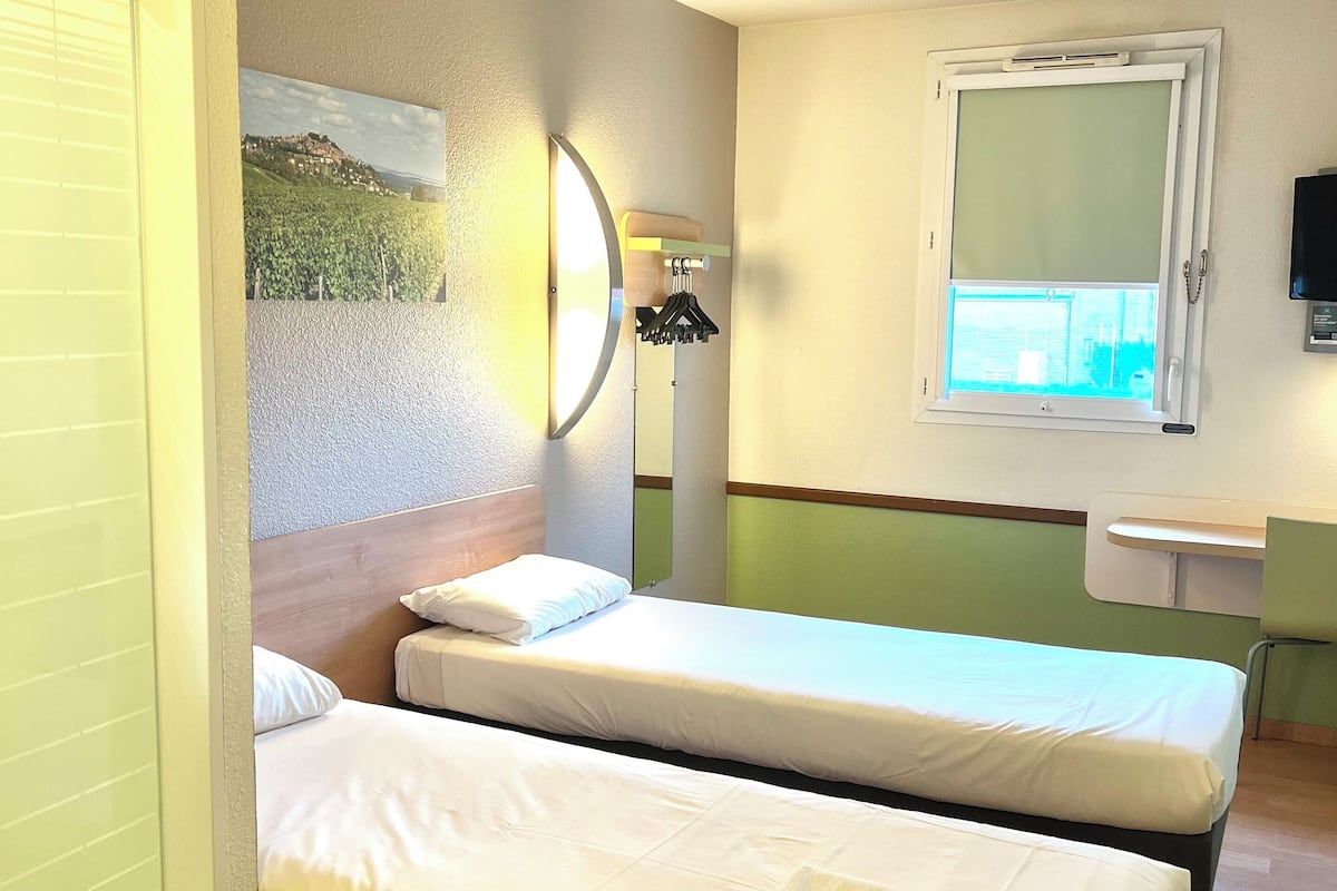 twin room, 2 single beds | desk, laptop workspace, blackout curtains, soundproofing