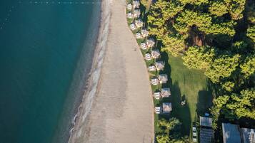 On the beach, sun-loungers, beach umbrellas, beach towels