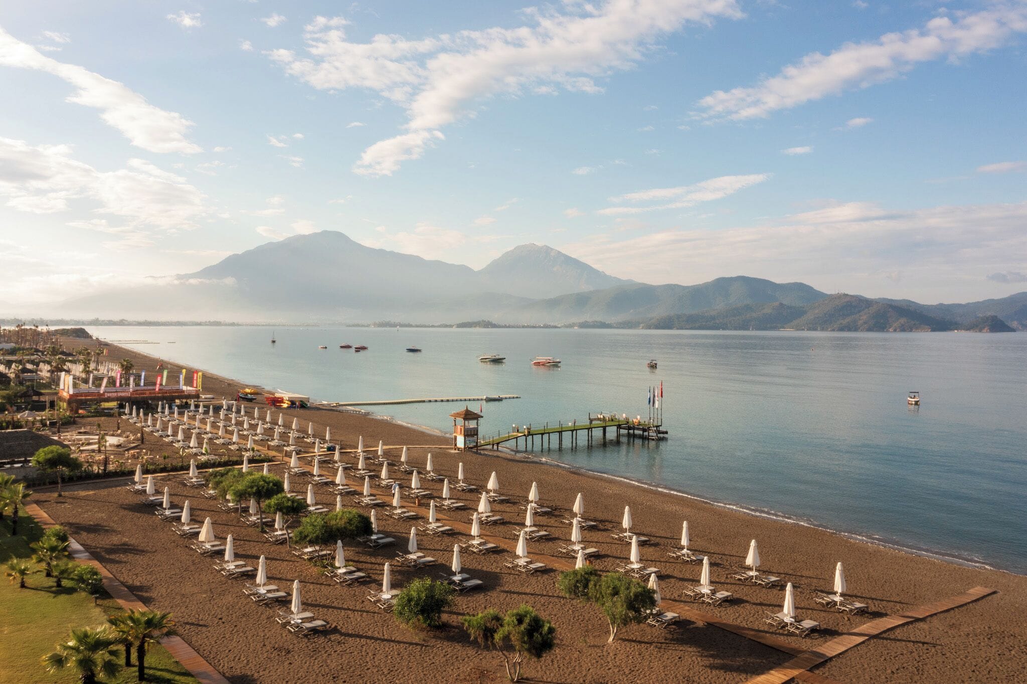 On the beach, sun-loungers, beach umbrellas, beach towels