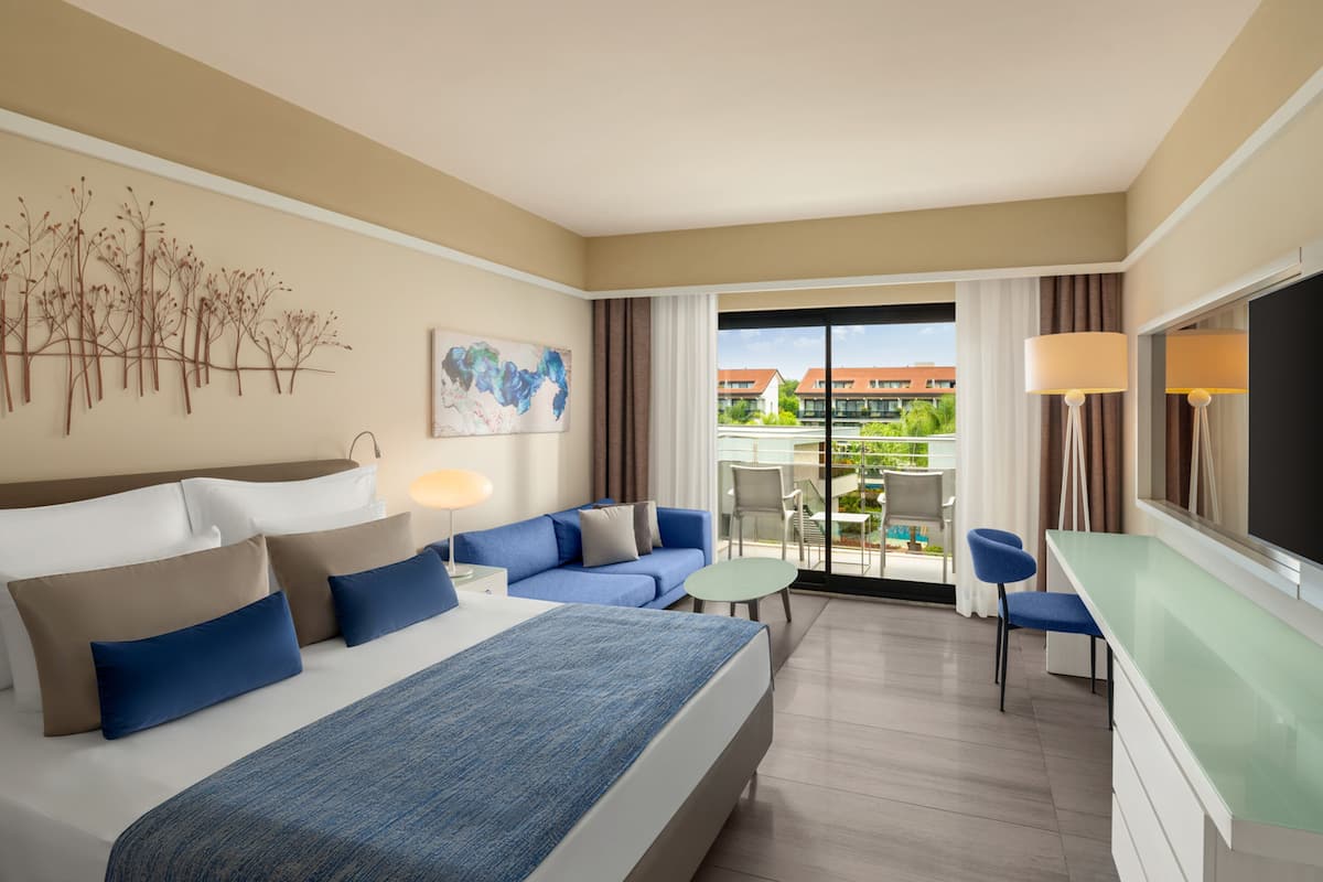 Adult Standard Land View Room | Free minibar, in-room safe, desk, iron/ironing board