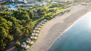 On the beach, sun loungers, beach umbrellas, beach towels