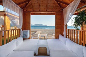 On the beach, sun loungers, beach umbrellas, beach towels