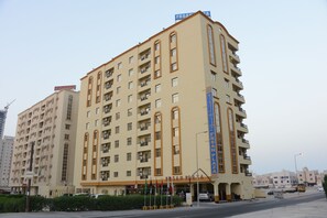 A multi-story hotel with a prominent sign reading 'FRSAN PLAZA'. - Frsan Plaza (Manama)