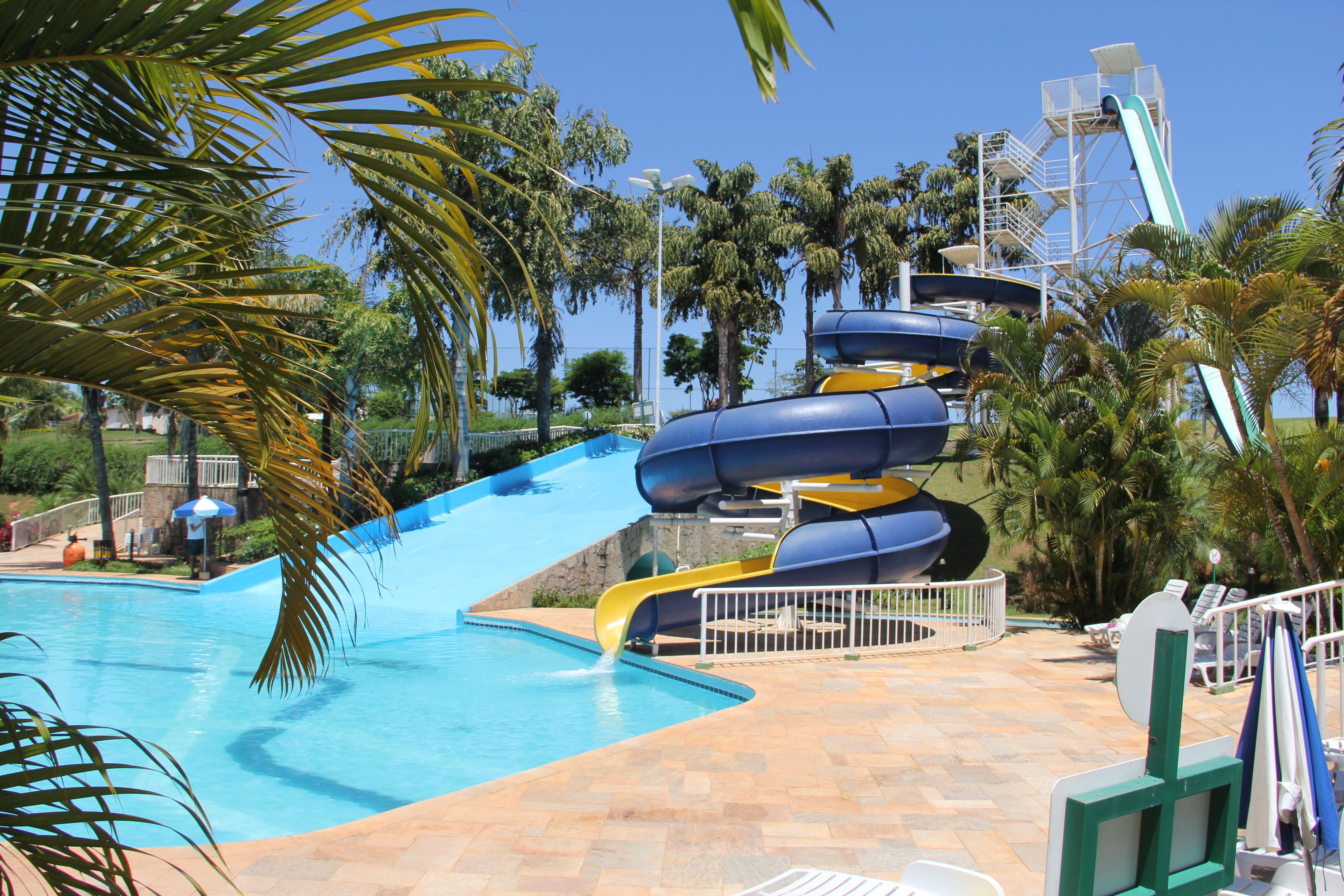 A water park with a large pool and multiple water slides.