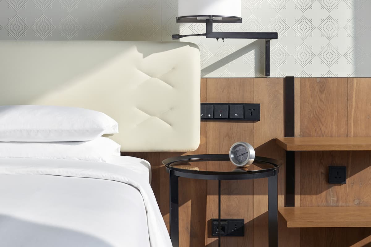 Premium bedding, down comforters, memory foam beds, free minibar items