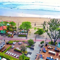 Beach nearby, white sand, beach umbrellas, beach towels