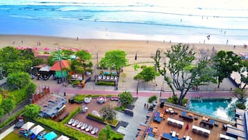 Beach nearby, white sand, beach umbrellas, beach towels