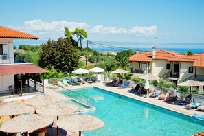 Seasonal outdoor pool, pool umbrellas, pool loungers