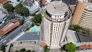 A tall, cylindrical building with a dome on top, labeled "Pampas Palace Hotel."