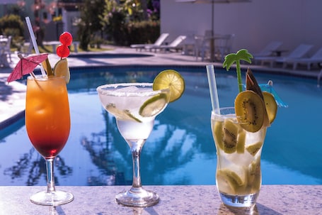 2 outdoor pools, open 9:00 AM to 10:00 PM, pool umbrellas, pool loungers. Aojesp Hotel Colonia