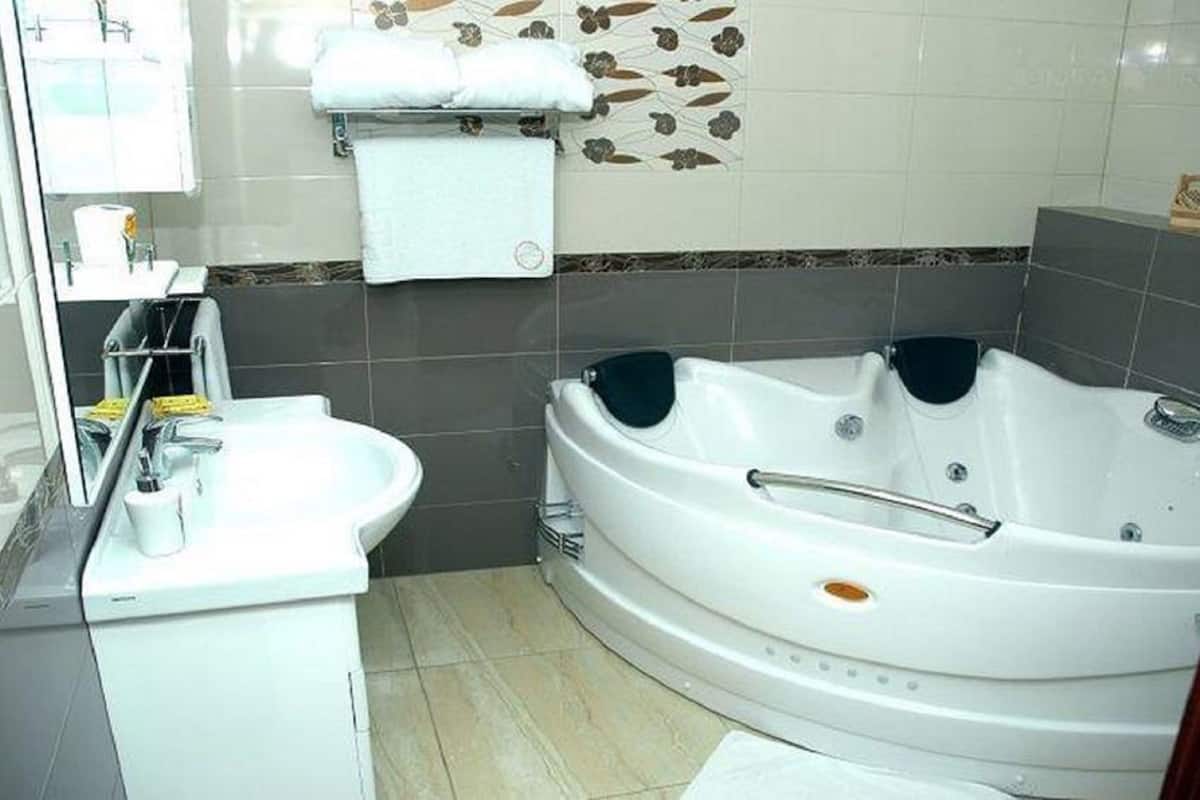 deluxe room | bathroom | bathtub, deep-soaking bathtub, free toiletries, hair dryer