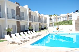 Seasonal outdoor pool, open 9:00 AM to 7:00 PM, sun loungers