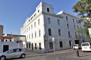 A historic building with a prominent 'HOTEL' sign, multiple windows, and a classic architectural style. - Bristol (Gibraltar)