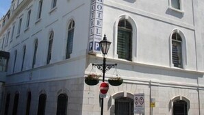 A white building with a sign that reads "HOTEL." - Bristol (Gibraltar)