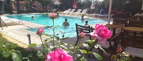 Indoor pool, outdoor pool, pool umbrellas, pool loungers
