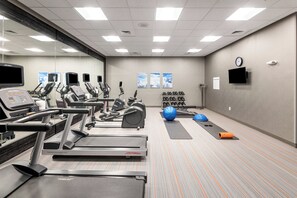 A fitness center with treadmills, elliptical machines, and exercise balls. - Holiday Inn Express & Suites Charlotte Airport by IHG (Charlotte)