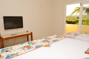Enjoy a comfortable stay with a flat-screen TV, desk, and two beds, plus a balcony with a view of the surrounding greenery.