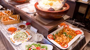 A buffet with various dishes including salads, appetizers, and a large bowl of shredded cheese. - Kuretake Inn Premium Shizuokaekimae (Shizuoka)