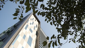A tall building with a checkered facade and large windows. - W Hotel (Incheon)