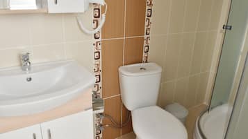 Shower, free toiletries, hair dryer, slippers