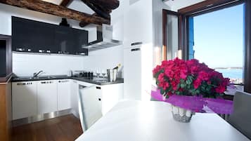 Apartment, 1 Bedroom, Terrace, Lagoon View | Private kitchen | Full-sized fridge, microwave, stovetop, dishwasher