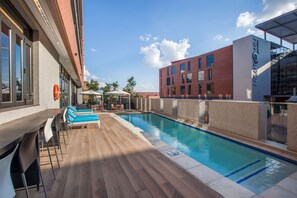 Seasonal outdoor pool, pool loungers