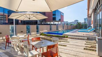 Seasonal outdoor pool, pool loungers