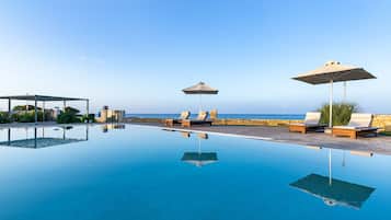 Outdoor pool, pool umbrellas, sun loungers