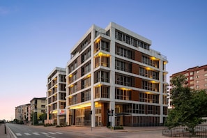 A multi-story hotel with a modern architectural design, featuring balconies and large windows. - Ramada Encore by Wyndham Konya Selcuklu (Konya)