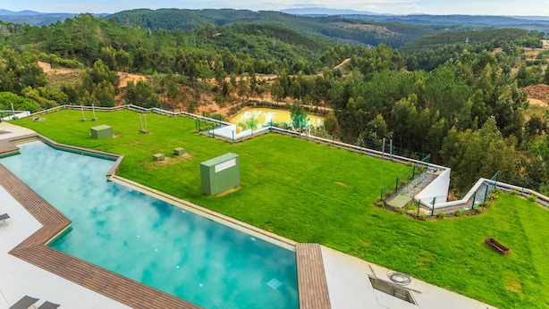 A pool area with a view of the surrounding landscape. - Enigma - Nature & Water Hotel (Odemira)