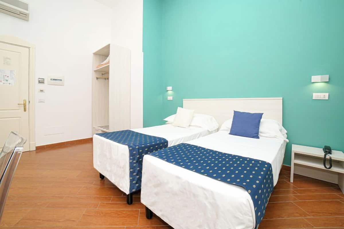 Economy Double or Twin Room | Minibar, in-room safe, desk, laptop workspace