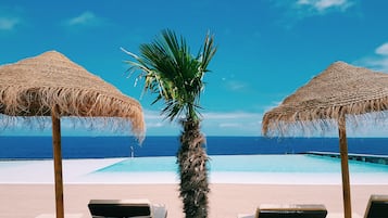 Indoor pool, outdoor pool, pool umbrellas, sun loungers