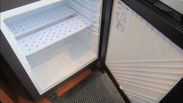An open refrigerator with two shelves and a control panel on the right.