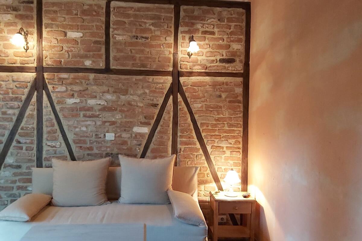 superior triple room, mountain view | living room | flat-screen tv