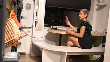 Single Capsule in a room with other capsules | In-room safe, individually decorated, individually furnished, desk