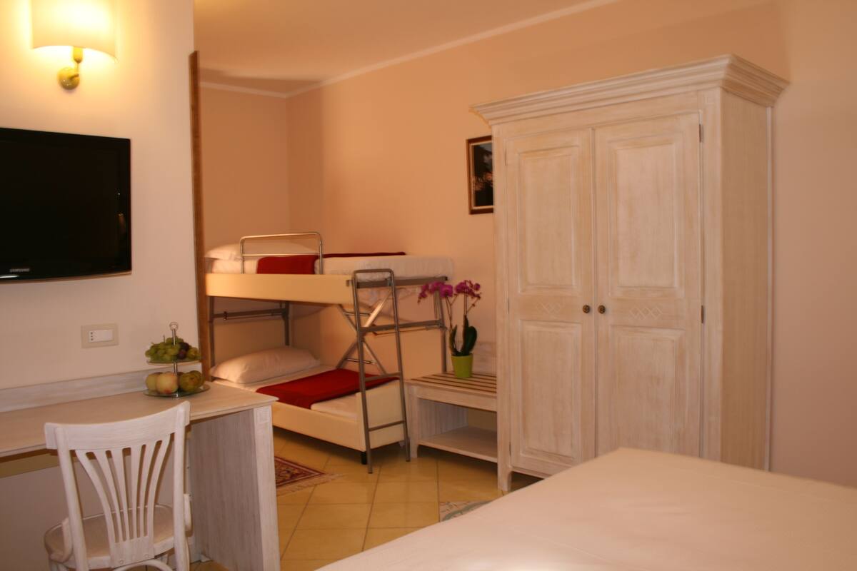 superior quadruple room | premium bedding, minibar, in-room safe, desk