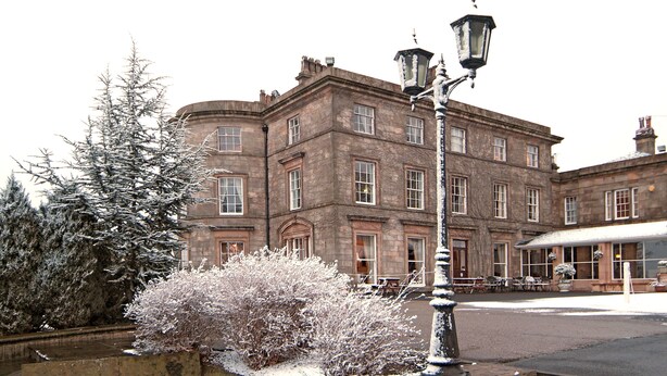 A historic building with a symmetrical facade, large windows, and a central entrance. - Shaw Hill Golf Resort & Spa Hotel (Chorley)