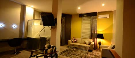 Suite, 1 chambre | Coin séjour