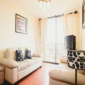 Apartment, 3 Bedrooms | Living area | 40-inch flat-screen TV with cable channels, TV, DVD player - Peru Apartments 4 Rent (Lima)