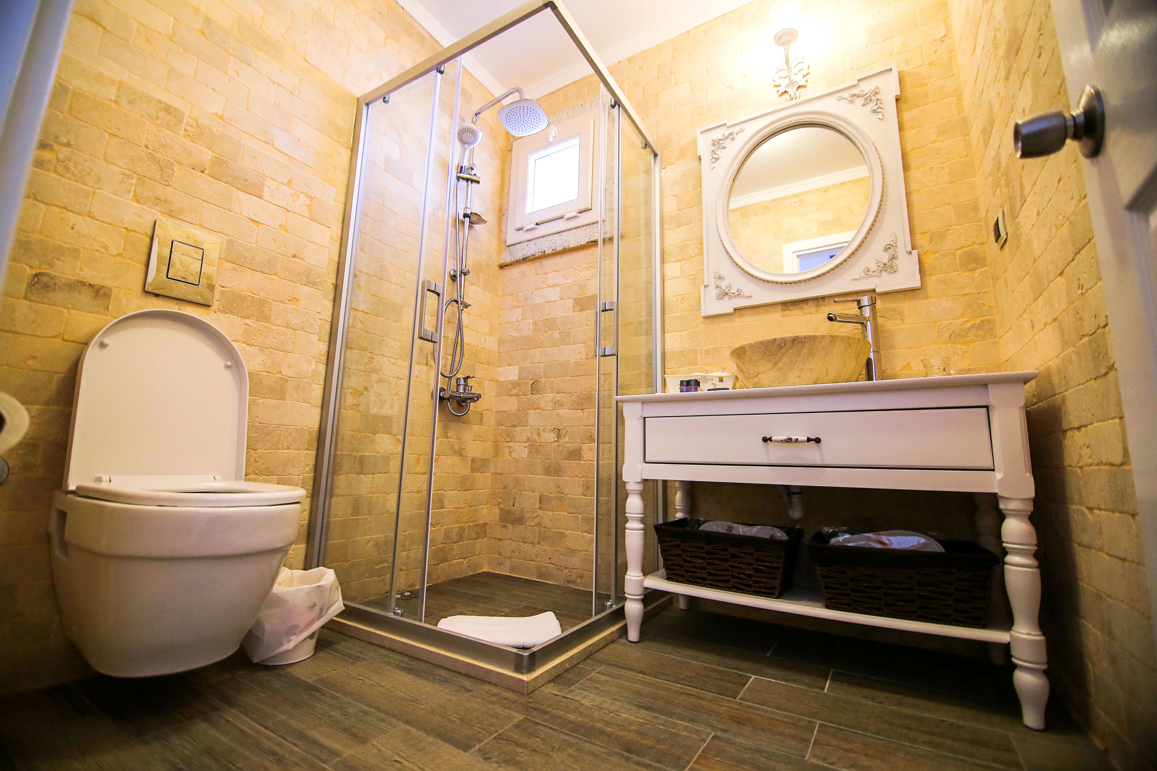 deluxe room, jetted tub | bathroom | free toiletries, hair dryer, slippers, towels