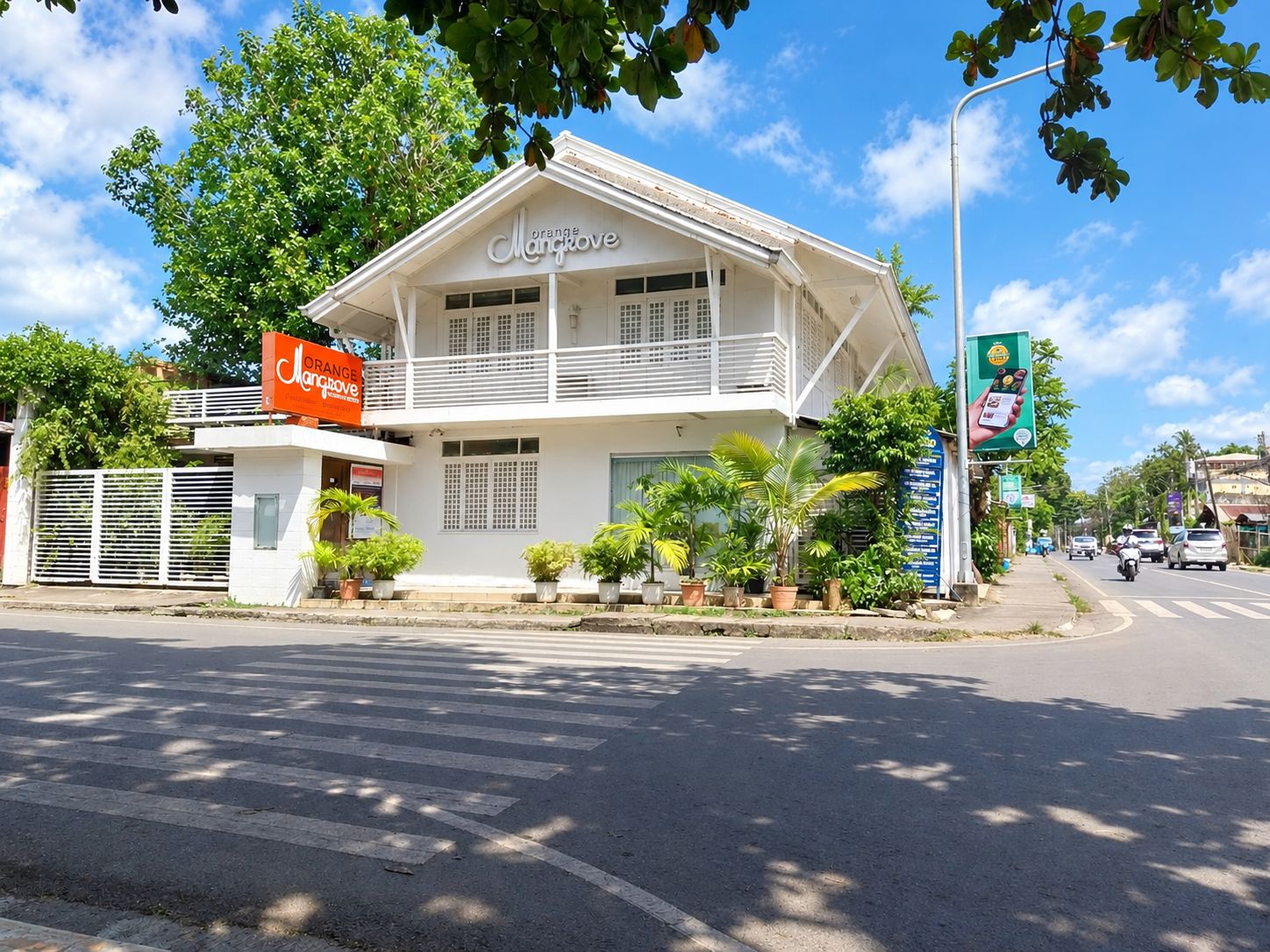 A two-story building with a sign reading 'Orange Man Cave.'