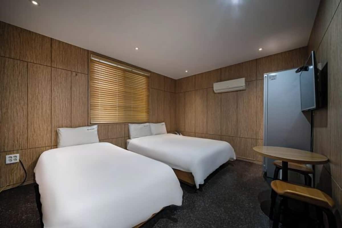 Premium bedding, desk, laptop workspace, soundproofing