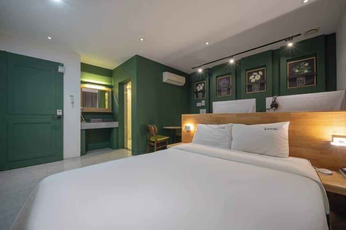 Premium bedding, desk, laptop workspace, soundproofing