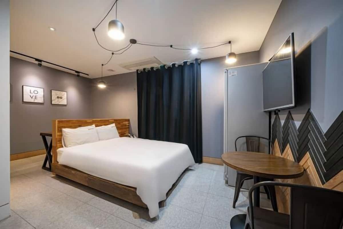 Premium bedding, desk, laptop workspace, soundproofing