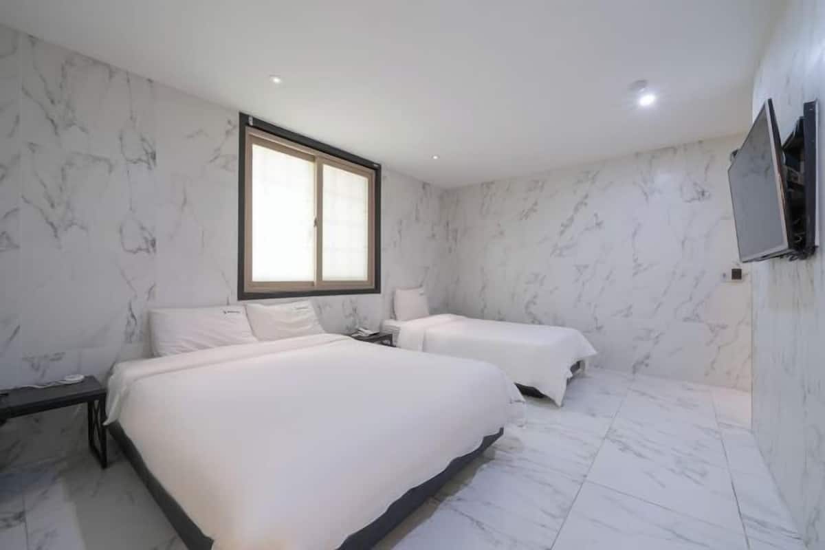 Premium bedding, desk, laptop workspace, soundproofing