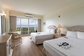Deluxe Room, Bay View | Minibar, in-room safe, desk, laptop workspace - Palasia Hotel Palau (Koror)