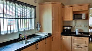 Full-size fridge, microwave, stovetop, coffee/tea maker
