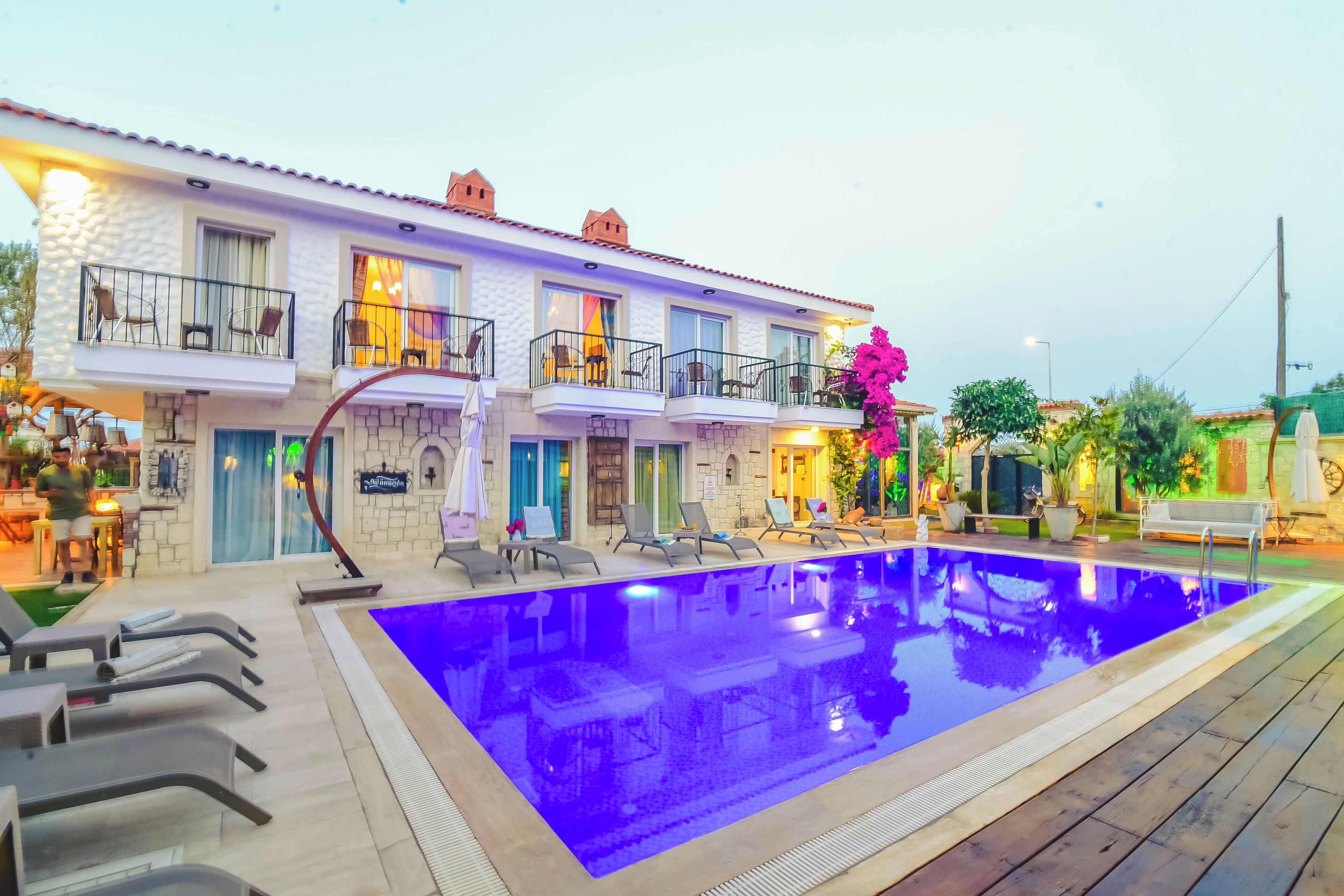 Outdoor pool, open noon to 7:00 PM, pool umbrellas, sun loungers