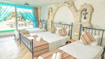Luxury Quadruple Room, Pool View | Premium bedding, minibar, in-room safe, desk