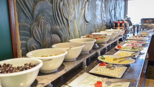 A buffet with various food items and bowls. - Horon Hotel (Trabzon)
